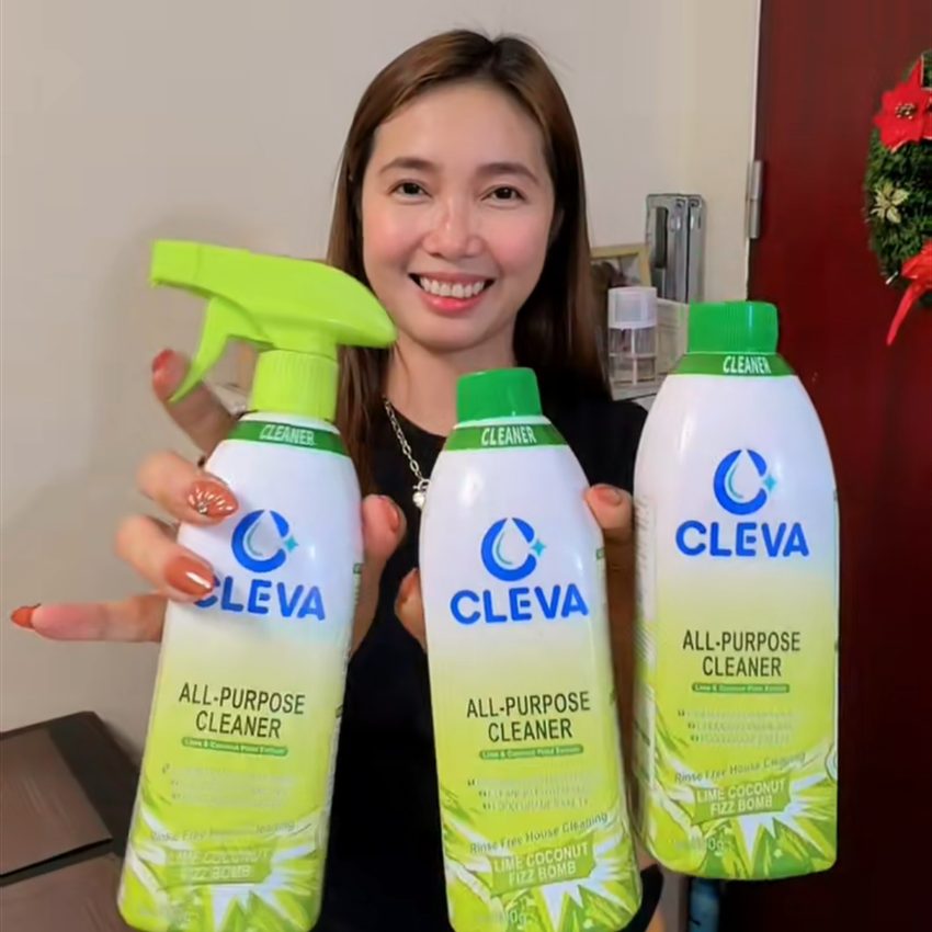 Customer holding two bottles of CLEVA Multi-Purpose Spray
